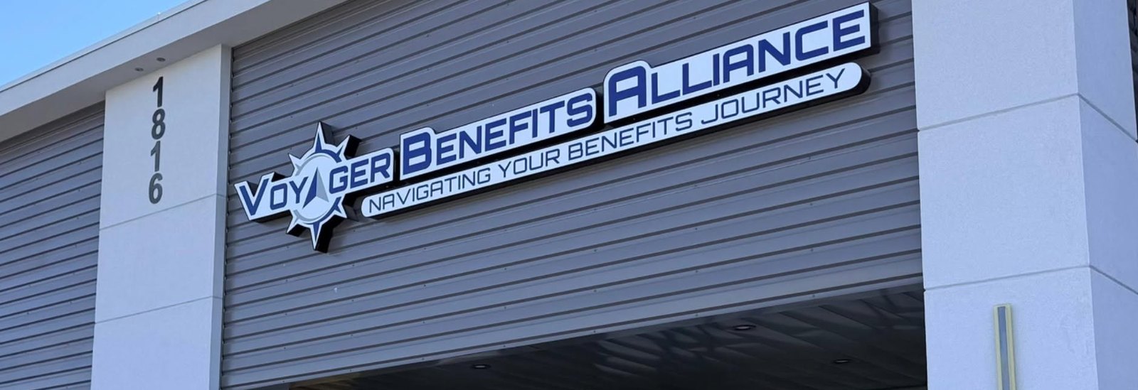 The Voyager Benefits Alliance storefront sign at 1816 South McColl Road in Edinburg, Texas